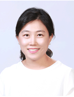Portrait of the researcher Han Yoonsun, in white shirt with a smile on her face